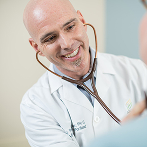 Provider Careers: Image of a smiling male doctor with a stethoscope