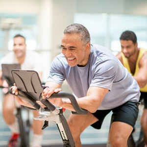 Classes and Events: Man in spin class on a stationary bike